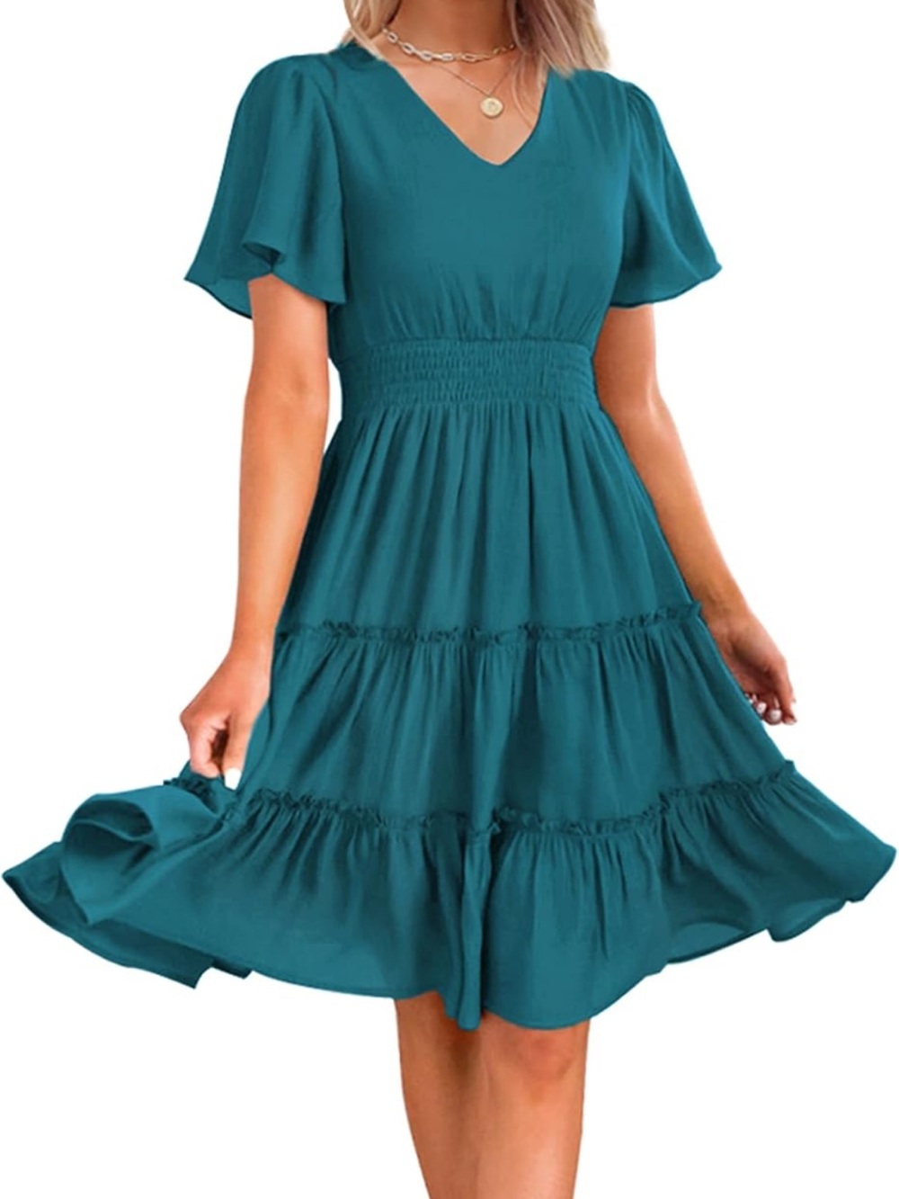 Teal green ruffle mini dress with tiered skirt and elastic waistband.